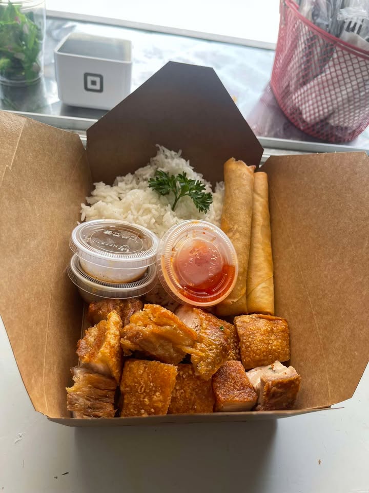 Crispy Filipino lechon roasted pork with rice and lumpia