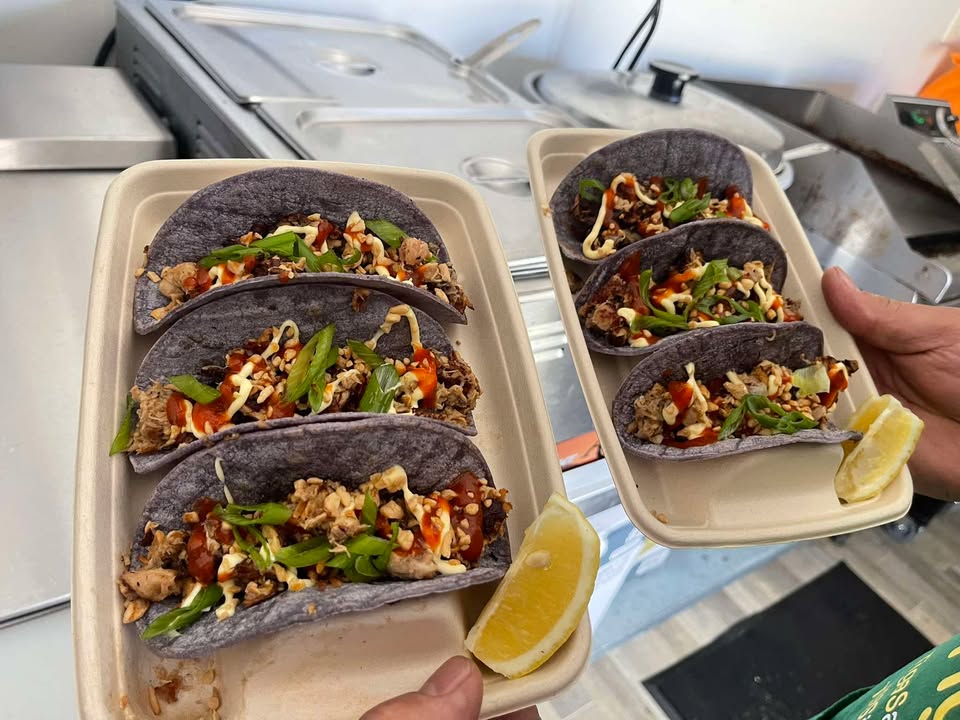 Filipino sisig tacos on blue corn tortillas
